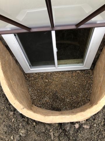 The RockWell Window System is a one-piece, rigid construction that is engineered for safety with a durable window well cover. It is UV stable, rust and rot proof, and stands up to extreme temperatures.