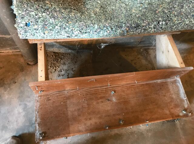 The homeowner had to roll up the carpet at the bottom of their stairs so mold would not grow on it.