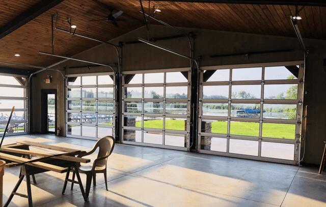 These unique doors provide a lovely breeze for customers on hot summer days. The LED recessed can lighting is also pictured, and they accent the point of the ceiling very nicely as they were installed going up the sloped ceiling.