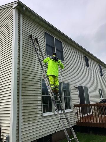 Pressure washing the back of the property in progress in Cheshire, CT.