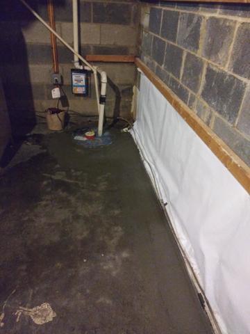 Finished Waterproofed Wall and Sump Pump