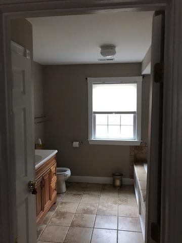 Interior painting in the bathroom uses the same color as the master bedroom previously shown.