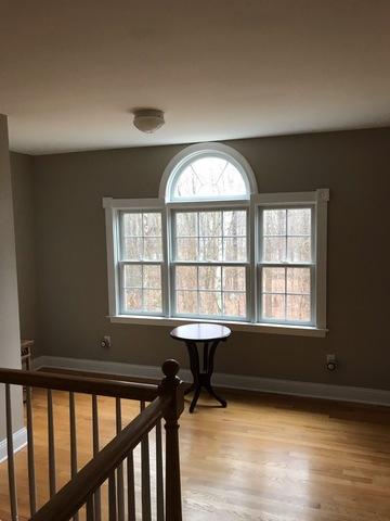 Interior painting in the hallway continues the color used in all other rooms in this house in New Canaan, CT.