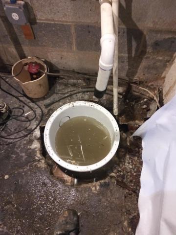 <p>This gnarly photo shows the sump pump before it is closed and the floor is sealed.</p>