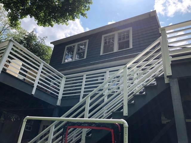 Matching the deck to the home completes this exterior painting project!