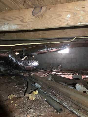 This subfloor was sinking, allowing the flooring and wall above to sink.