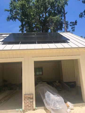 <p>Eddie and Tito, our two installers, installing the panels!</p>