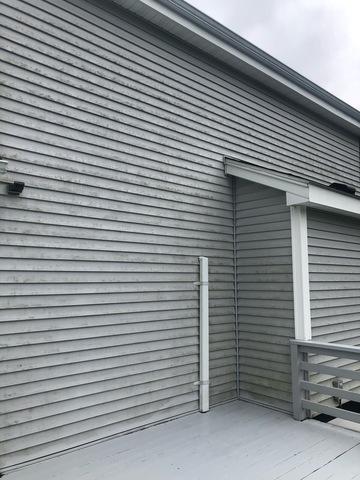 <p>Pre-power wash photo shows the pollen collecting on the back end and deck on this property in Seymour, CT.</p>