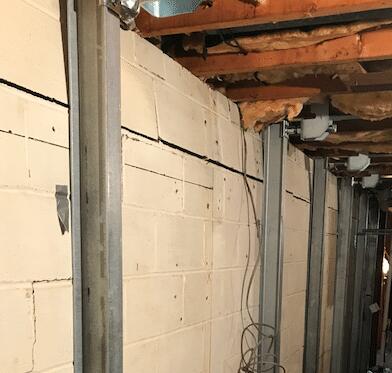 The Power Braces have been installed. The wall is now stabilized and the straightening can begin.