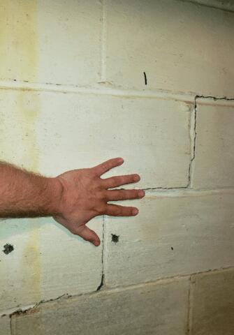 There were several large stair-step cracks along the basement walls.