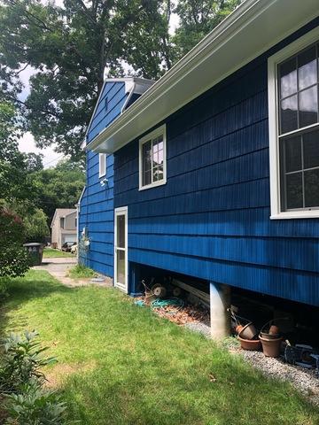 <p>Exterior painting result shows white trims and doors to match the garage door and window section in Stamford,CT</p>