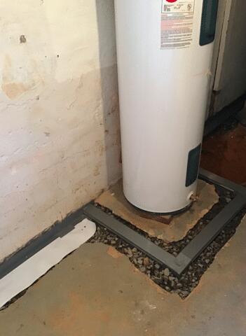 The Fortress Team installed a Trench Drain around the water heater to ensure no water could touch it.