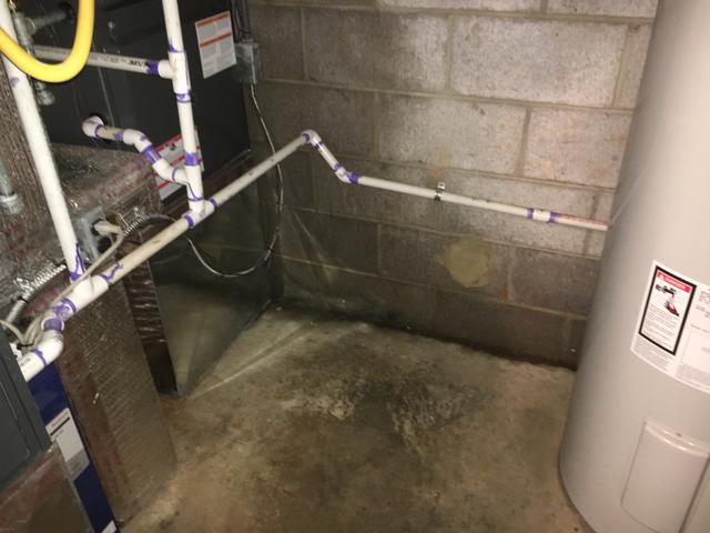 Before Basement Waterproofing - Water Stains near Mechanical Equipment