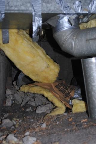 Messy and old insulation in crawlspace