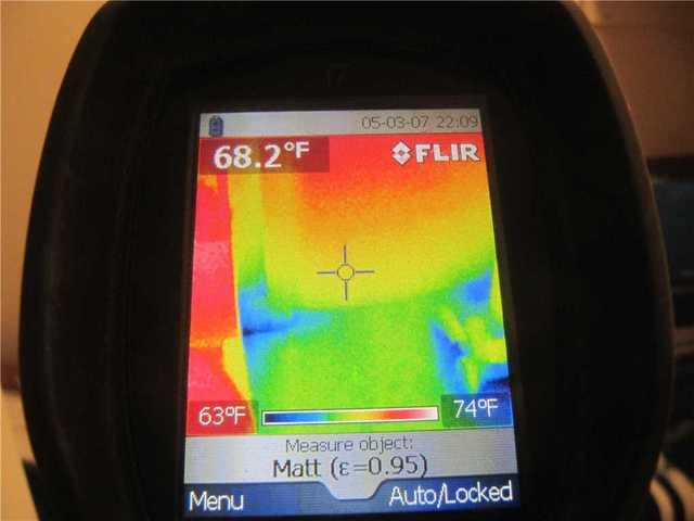 This next spot shows how cool air can pass through a knee wall. The cavity under the roof often is under insulated, which means your heated air leaves through the leaky door and allows cool air from outside to replace it, as seen where the blue is.