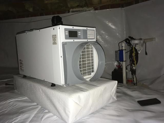 In order to dehumidify the air within the crawlspace.