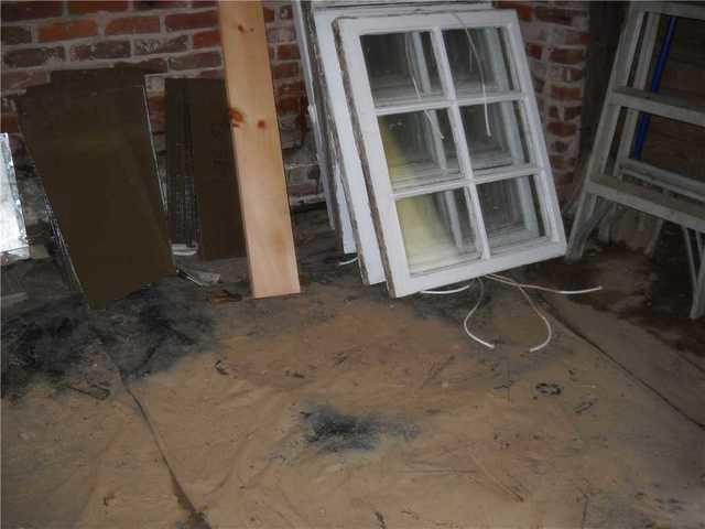 This basement has a dirt floor with a thin sheet of plastic covering the floor. This plastic isn't particularly helpful, especially when it comes to moisture issues.