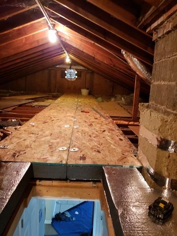 Attic insulation in progress