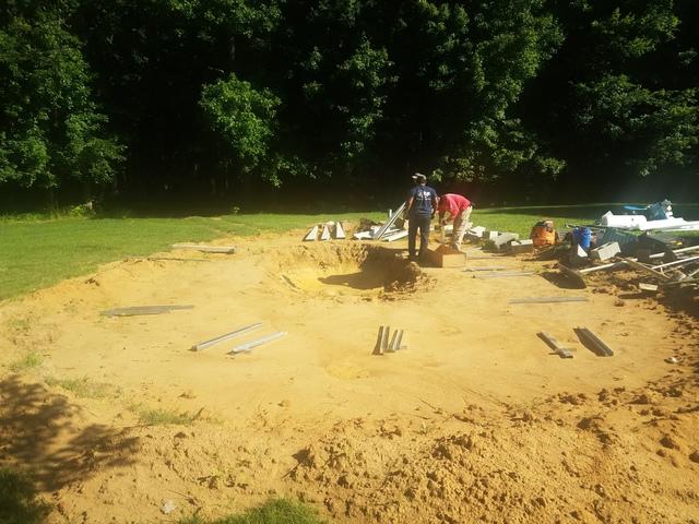 The ground is excavated and the crew is ready to begin installation