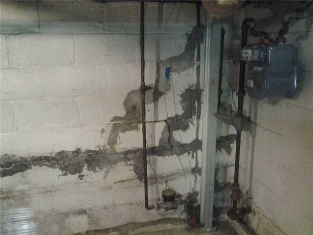 <p>Damaged wall supported by our PowerBrace. Simply fixing it "for now" will never be good enough as you can see in this case. Thanks to the PowerBrace, this homeowner can now rest knowing that this basement wall will remain supported.</p>