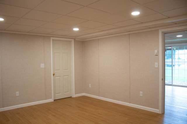 A finished sitting area in Salem, NH featuring our pre-finished fabric wall system