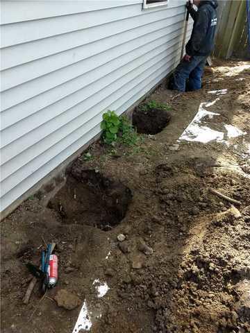 Helical Piers Outside of Garage