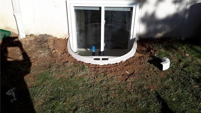 An Everlast Window was installed looking in towards the homeowner's basement. Everlast Windows lock on tight to prevent leaks from the outside.