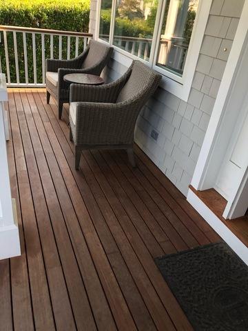 Adding a fresh stain coat to this cute front porch as well.