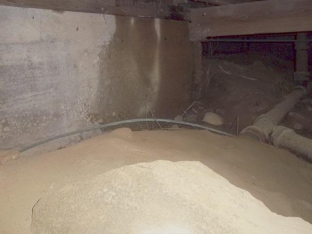 In wet crawl spaces such as the one in this South Lyme, CT home, we install our CleanSpace Drainage Matting. This plastic matting with raised dimples gives any water that enters the crawl space a channel to get out, so that it doesn't collect under the liner. The homeowners now have a dry, functional storage space. 