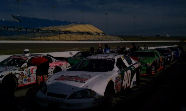 <p>Here is a photo of the cars in the pit area before the race begins. Our team is getting ready!</p>