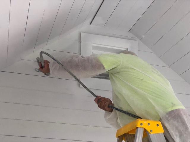 Spraying the outline first on the walls and roof.