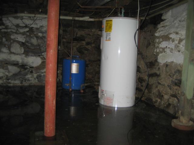 Flooding in the basement of this Bantam, CT home was preventing the homeowners from using and enjoying the space. Basements with these fieldstone foundations are often wet due to the cracks in the mortar joints. To dry out the basement in the long term, we installed our SuperSump pump system with an optional 1/2 horsepower sump pump. This powerful sump pump can remove up to 4,300 gallons of water per hour from the basement, keeping the basement dry even in the face of heavy rains. 