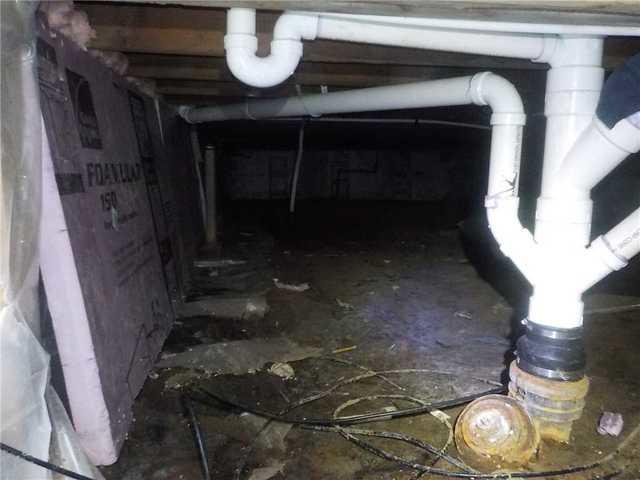 This crawl space had constant moisture issues, standing water in half of the crawl space, and mold growing on the beams.