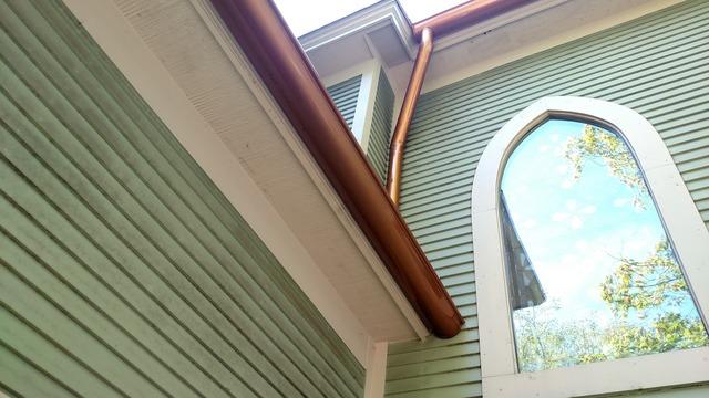 Copper gutter side of home