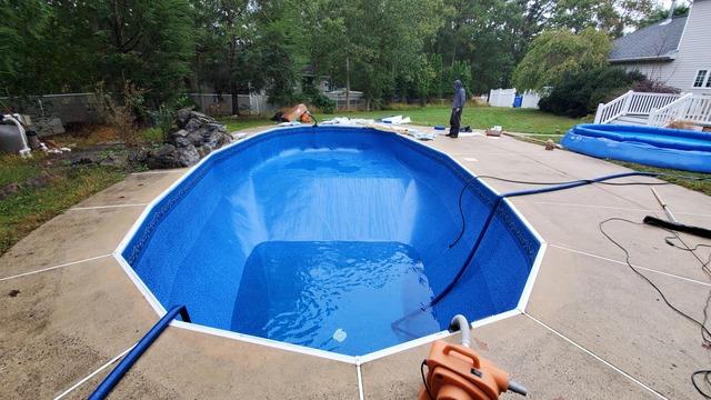 The new liner is in and the pool is slowly filling with water