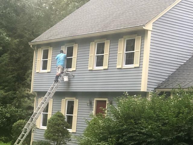 During this exterior power washing, workers made sure the windows were clean too!