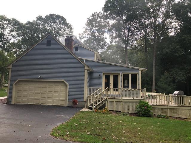 The garage and sides are slow to dry in the overcast weather after this pressure wash wraps up.