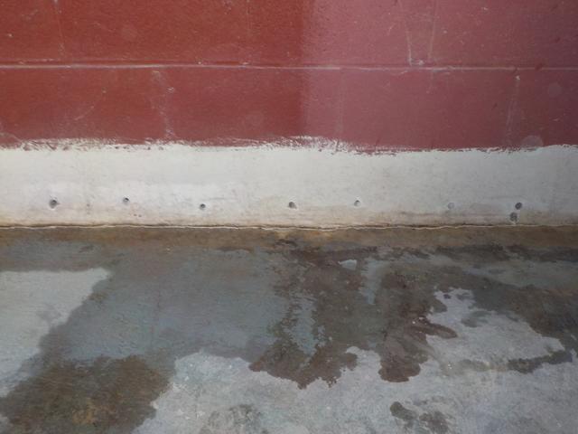 These holes are drilled at the bottom of cement blocks to release trapped water.