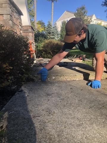 Crew Member Working on Sunken Walkway in Middletown, NY