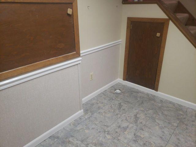 We did a wall restoration, replacing the bottom portion of the walls to repair damage but avoid a total tear-out.