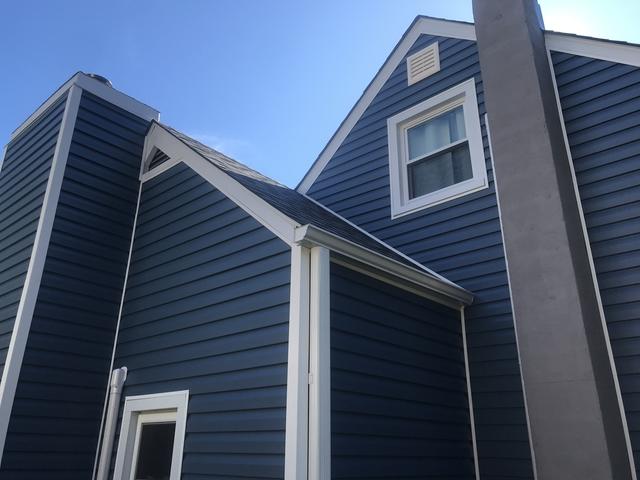 After the siding was replaced we also replaced the gutters to match the new white trim