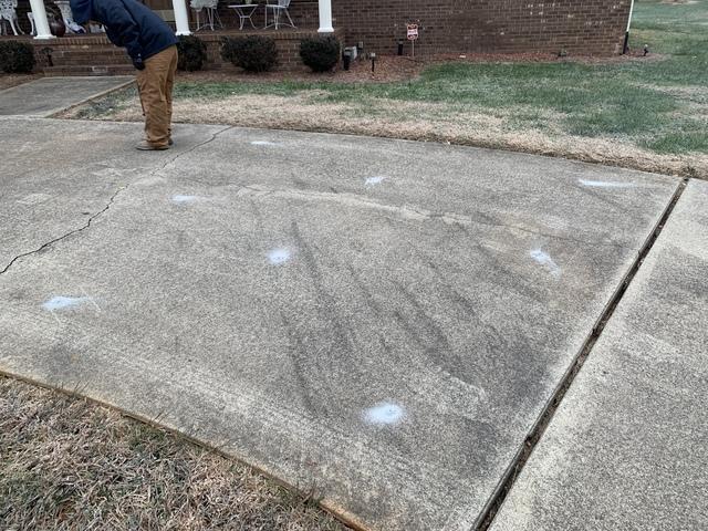 Nick Drilling Holes to Pump PolyLyft Into the Void