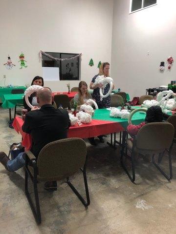 Everyone together working diligently on their wreaths. We take crafting very seriously around here!