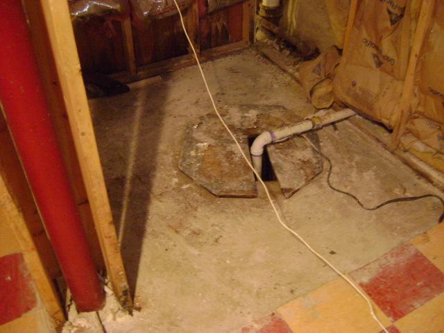 Old Grimy Sump Pump in Pelham, NY