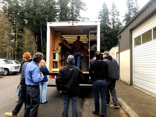 Everyone gathered around the magnificent spectacle that was the inside of our newly wrapped box truck.