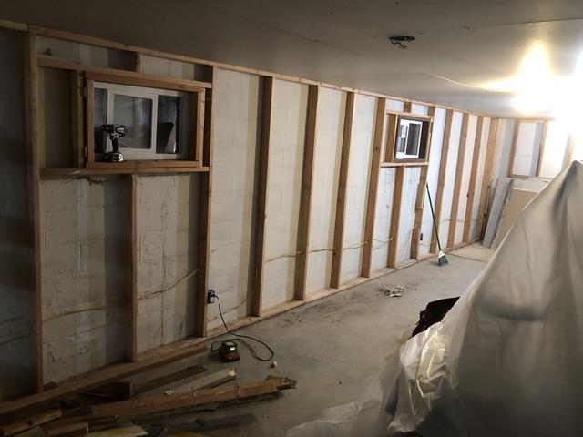 Durning wall prep for Basement To Beautiful Panels in Eagle, ID