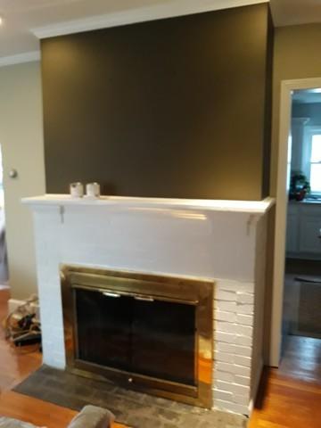 This final product included painting the accent color used in the foyer above the fireplace.