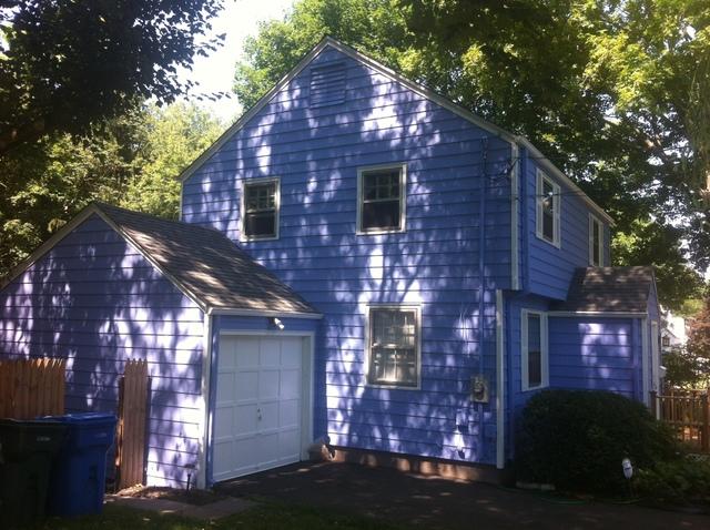 Blue House Painting with White Trim