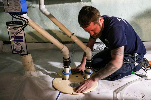 Foreman, Justin completes the installation of one of two Triple Safe Sump Pump Systems for this Erieau Crawl Space