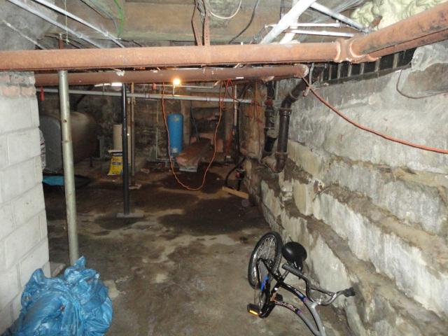 The basement of this home in Goshen, CT had visible wet areas on the floor and walls. Water problems are common in basements with a field stone foundation, like this one. Water can seep in through tiny cracks in the mortar joints. We installed our WaterGuard sub floor drainage system around the perimeter of the basement. Our unique drains are highly resistant to clogging, and they pull water out of the walls, preventing it from entering the basement. The homeowners now have a dry basement to enjoy. 